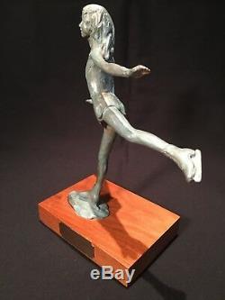 Bronze sculpture by NANCY DUPONT TWYMAN titled Poetry On Ice female ice skater